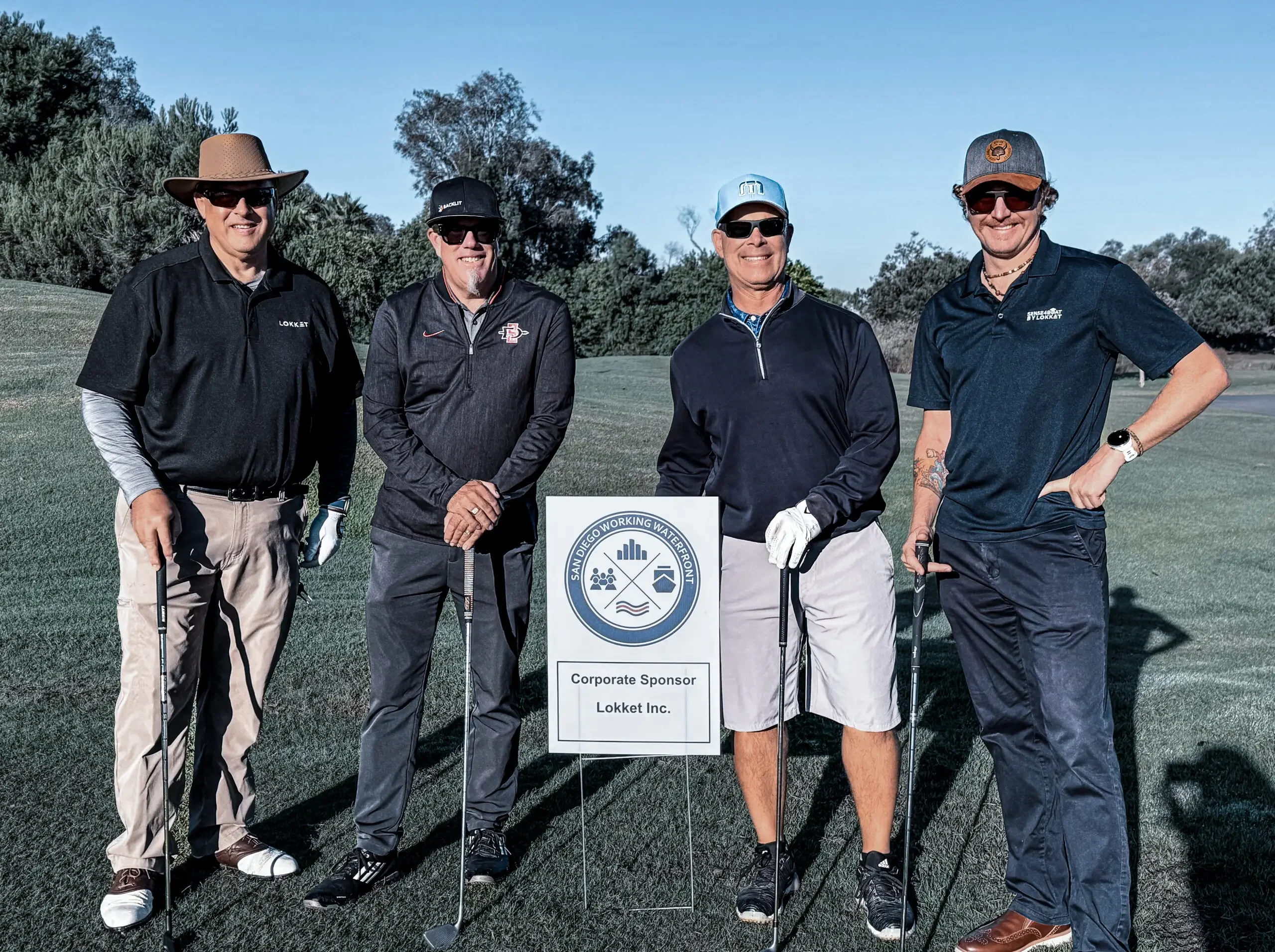 The Lokket boat cleaning team in San Diego playing golf with the San Diego Working Waterfront